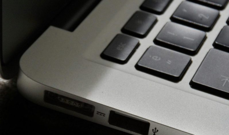 Free Detailed view of a silver laptop showing keyboard and multiple ports. Stock Photo