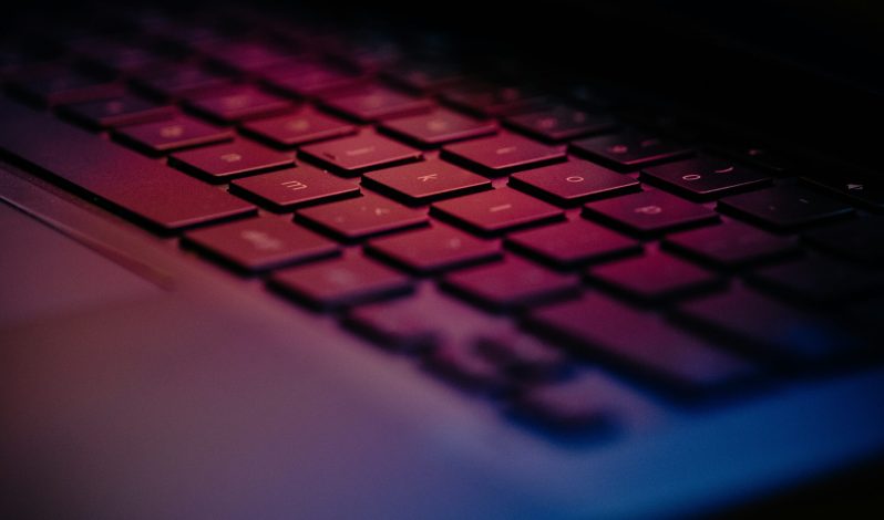 a-close-up-of-a-keyboard-with-a-blurry-background
