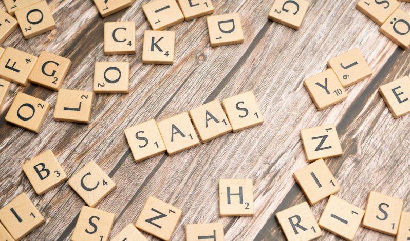 scrabble-letters-spelling-saas-on-a-wooden-tabl