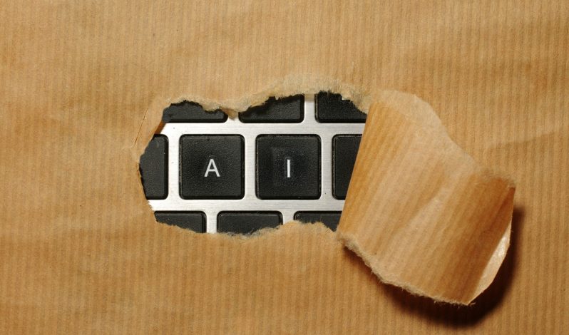 A piece of cardboard with a keyboard appearing through it